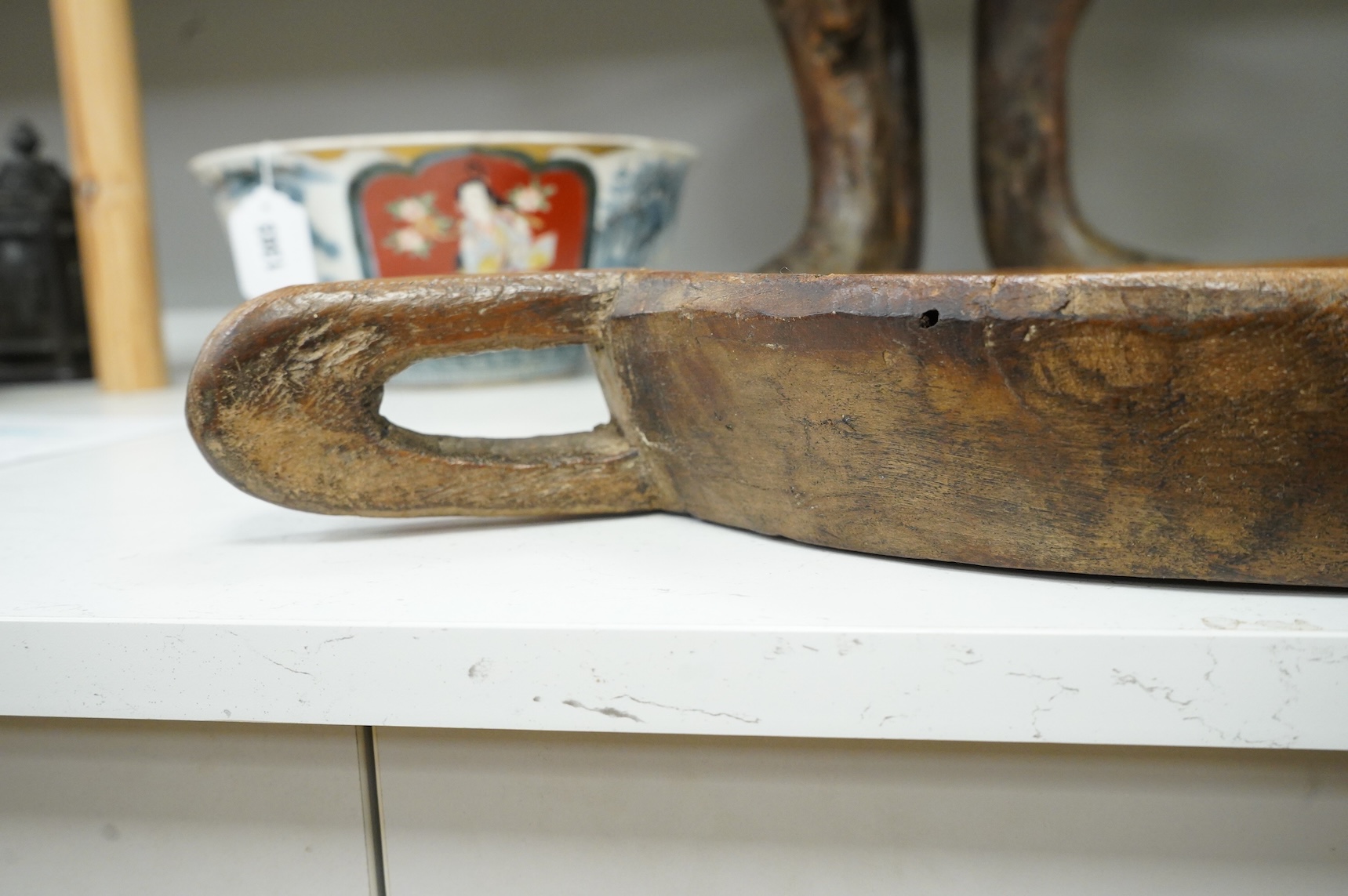 An Ethiopian tribal three footed stool and a carved handled bowl, stool 33cm high